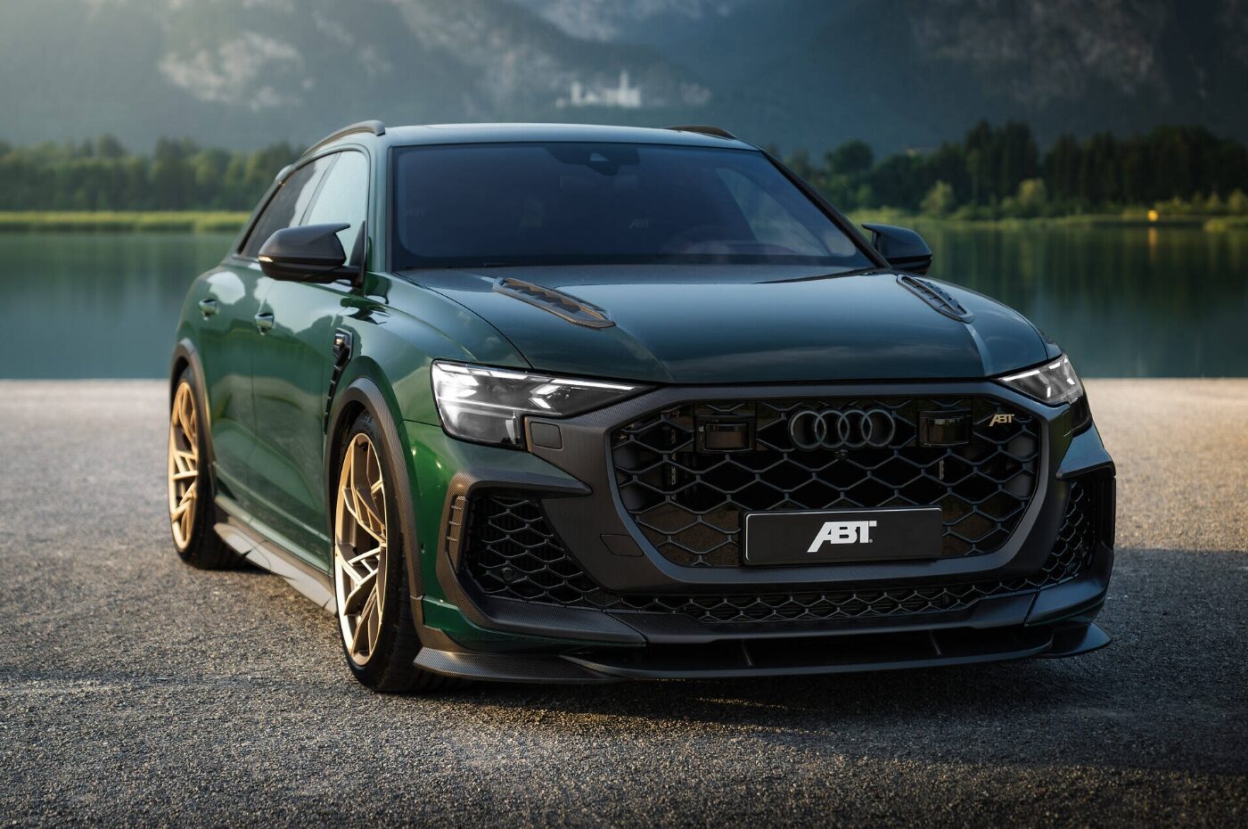 Green ABT Sportsline Audi photographed beside a lake